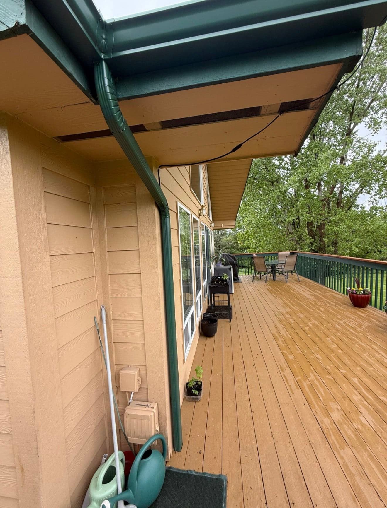 Evergreen Gutter Installation Keeps Lynda's Deck and Foundation Dry image