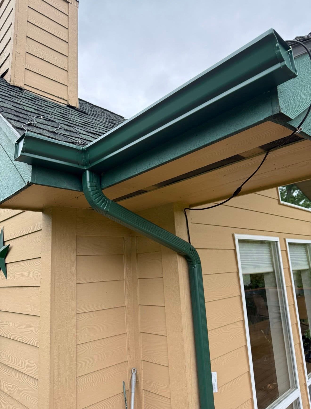 Gallery photos for Evergreen Gutter Installation Keeps Lynda's Deck and Foundation Dry: Image #1