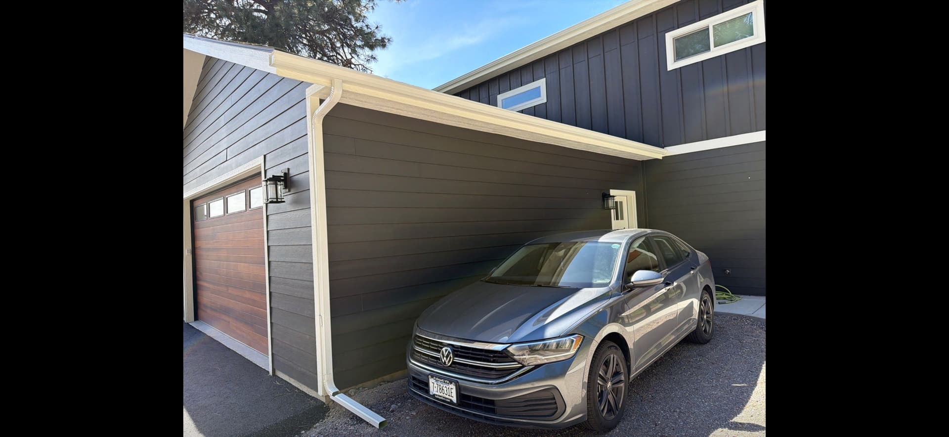 Gallery photos for Seamless White Gutter Installation on a Two-Story Modern Home: Image #7