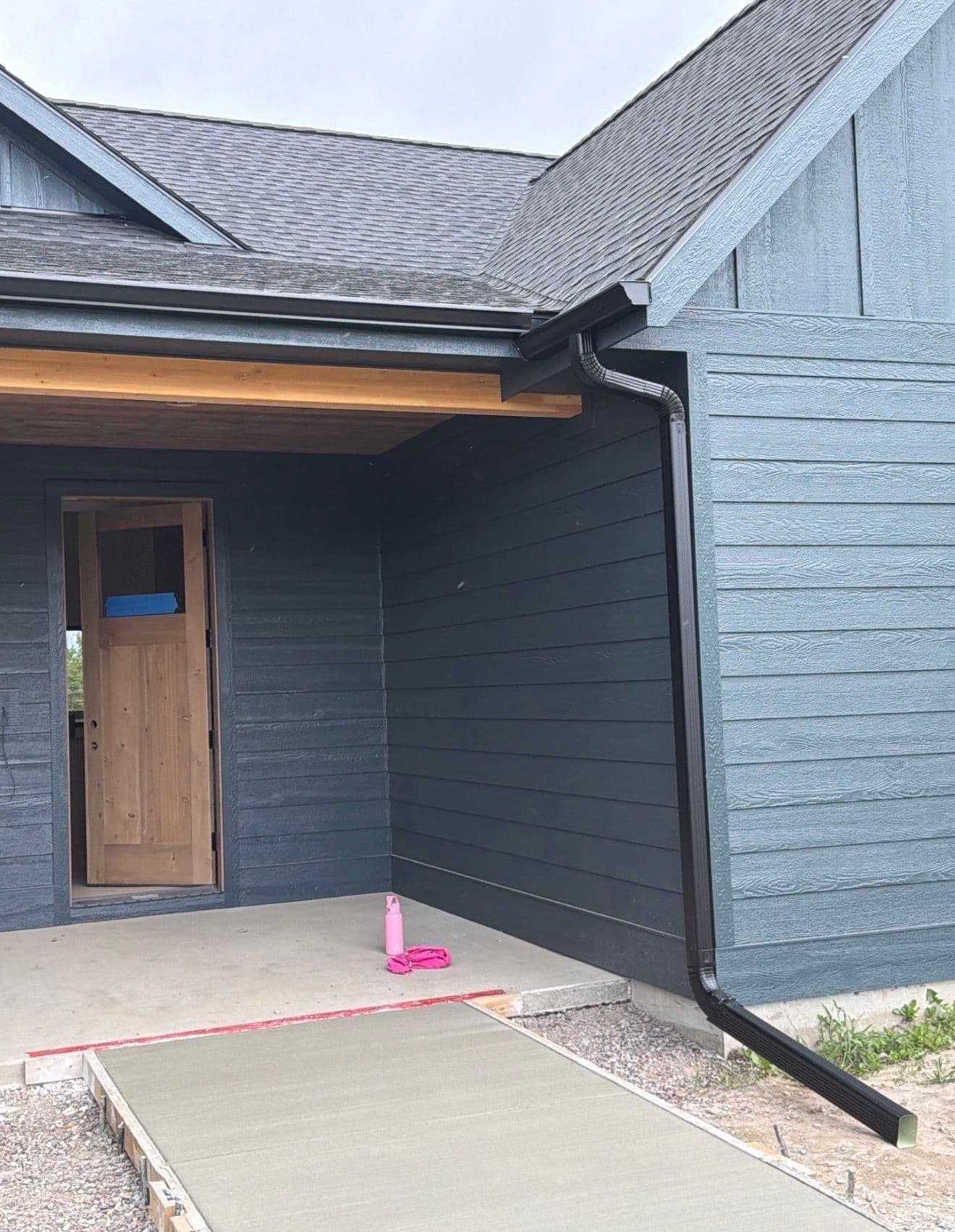 Gallery photos for Black Gutter Installation with Oversized Downspouts on New Construction: Image #1