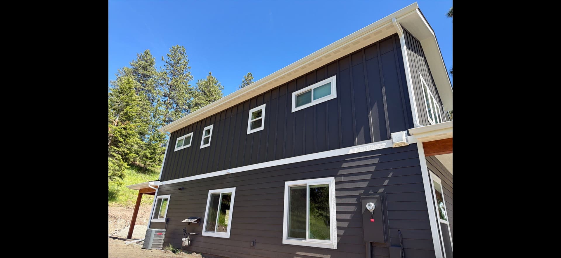 Gallery photos for Seamless White Gutter Installation on a Two-Story Modern Home: Image #3
