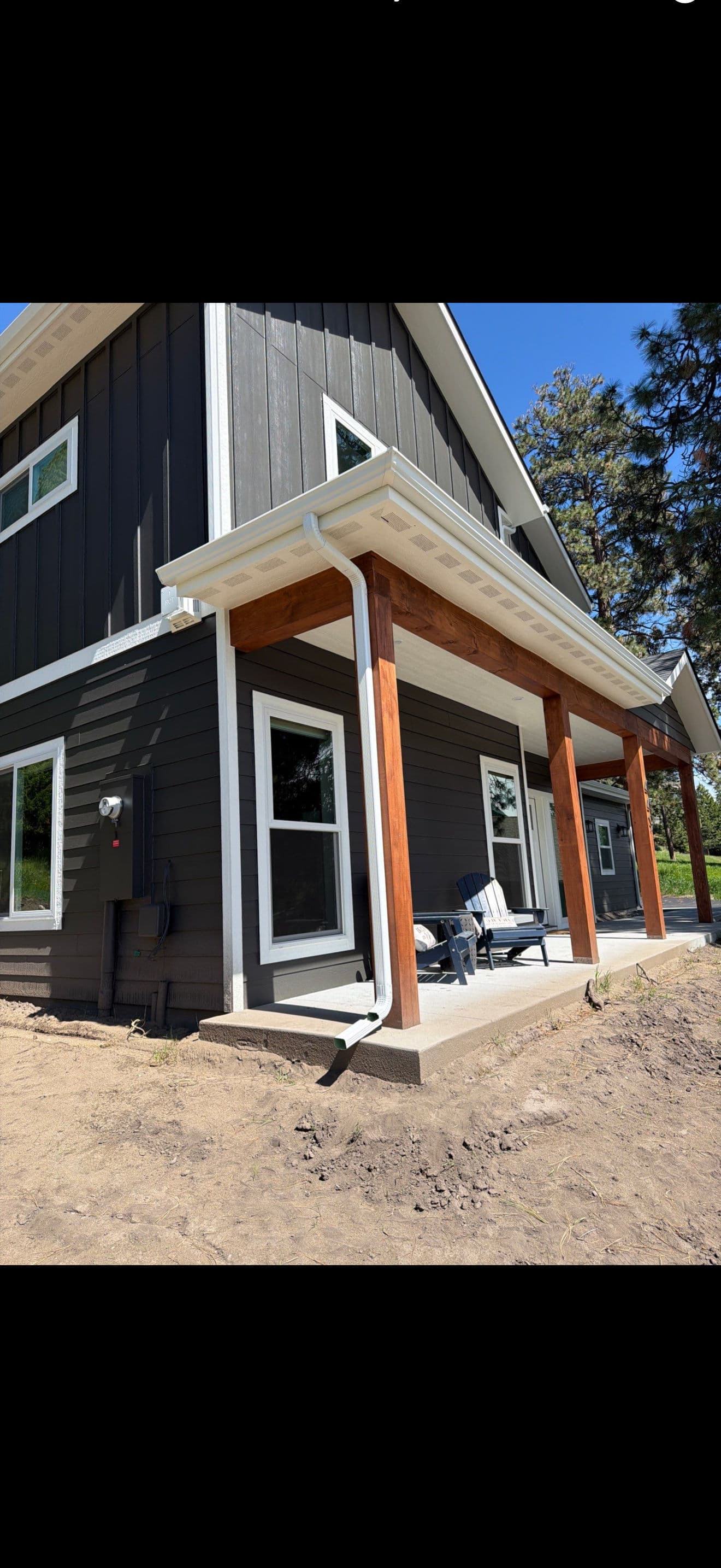Gallery photos for Seamless White Gutter Installation on a Two-Story Modern Home: Image #2