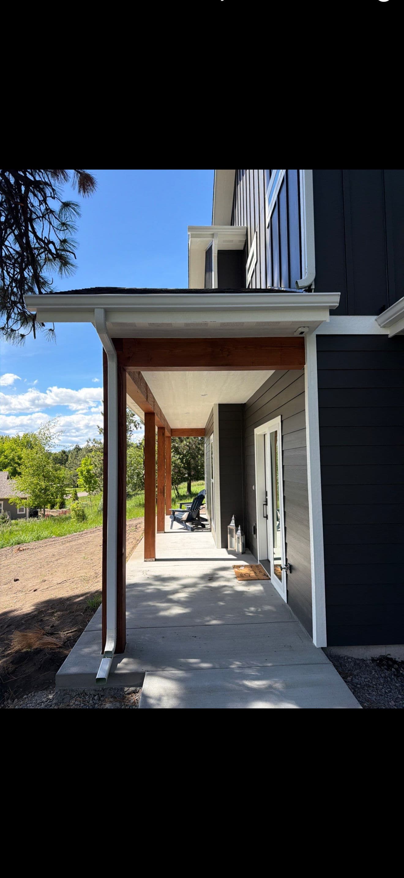 Gallery photos for Seamless White Gutter Installation on a Two-Story Modern Home: Image #1